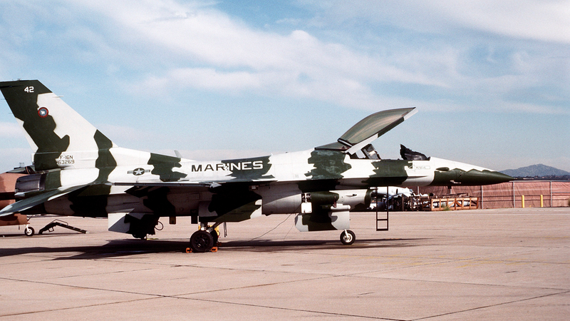 Stabilizers hang down when parked. Note external ladder, true navy planes have them built internally.